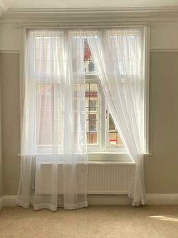 White Slot Top Voile Curtains Enhancing Lounge Bay Window and Bedroom Window